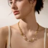 S83a983bdbce44aaea7ee8941b8e49ac3p.webp The Aura Pearl Toggle Necklace – 18K Gold PVD Plated