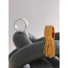 Sa3ae97767c64442aa498db934e0968acZ.webp Aura Gold Tassel Ring – 18K PVD Plated Stainless Steel